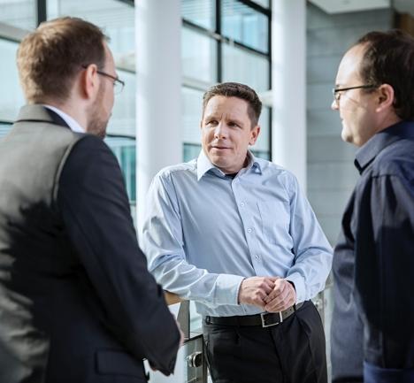 three men talking about sap